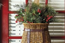 12 a basket with faux evergreens and berries can be used instead of a front door wreath