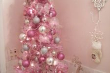 12 a bold pink Christmas tree with pearly, silver and pink ornaments