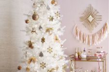 12 a white tree with gold and gold glitter ornaments create a very refined look