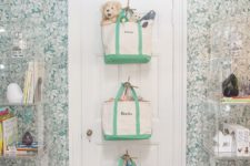 fabric bags attached to the door for storing everything your kid needs