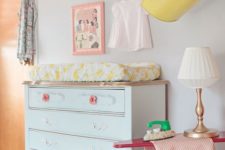 13 metal box shelves over the changing table with diapers