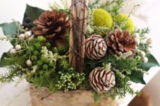 14 a basket with pinecones, billy balls, greenery and foliage for a strong festive spirit
