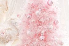 14 a pastel pink little tree with matching and silver ornaments for a sweet look