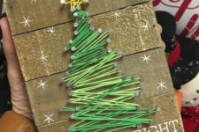 14 a reclaimed wood sign with a gree Christmas tree string art