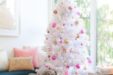 14 bold pink, gold, pearly and copper ornaments with a bold top bow are nice on a white tree