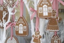16 gingerbread cookies on plaid ribbons are one of the cutest things for Christmas