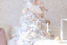an enchanting Christmas tree with blush, gold and whiet ornaments and ribbons is a dreamy and beautiful idea