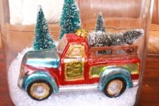 DIY Christmas terrarium with a truck and trees