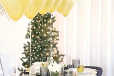 02 a black and gold glitter tablescape with metallic touches and some white blooms