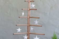 02 a copper pipe Christmas tree with white paper star ornaments