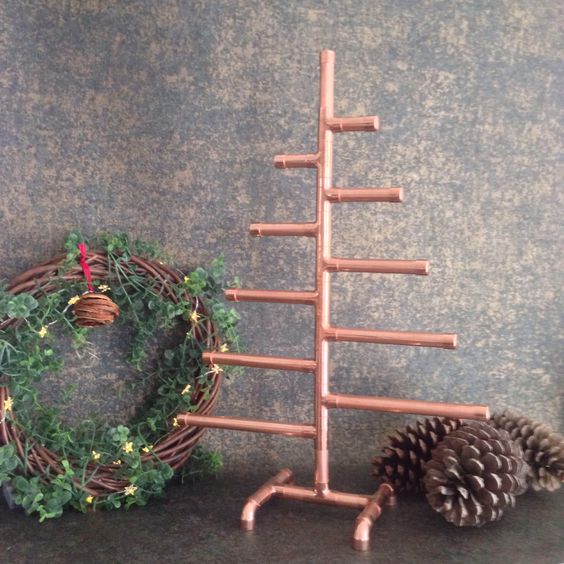 a tabletop copper pipe Christmas tree can be decorated in many ways