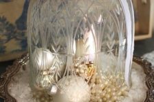 05 a vintage cloche with pearls, pearly ornaments and fake snow looks refined
