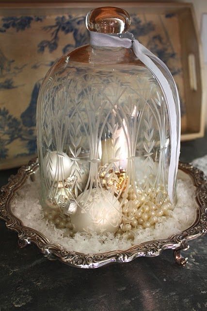 a vintage cloche with pearls, pearly ornaments and fake snow looks refined