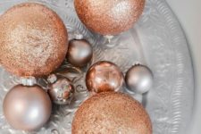 05 an arrangements of silver and copper glitter ornaments for festive decor