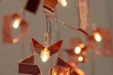 06 a copper cookie cutter with lights garland is a gorgeous and unusual decoration