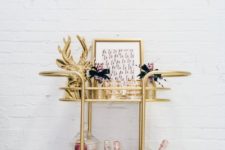 06 a gold deer head, a tall jar with colorful ornaments and glitter champagne bottles
