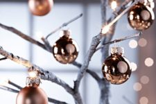 07 matte and shiny copper ornaments on branches are a great holiday decoration to make