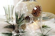 08 a cloche with sheer glass ornaments and pinecones plus pine needles as a centerpiece