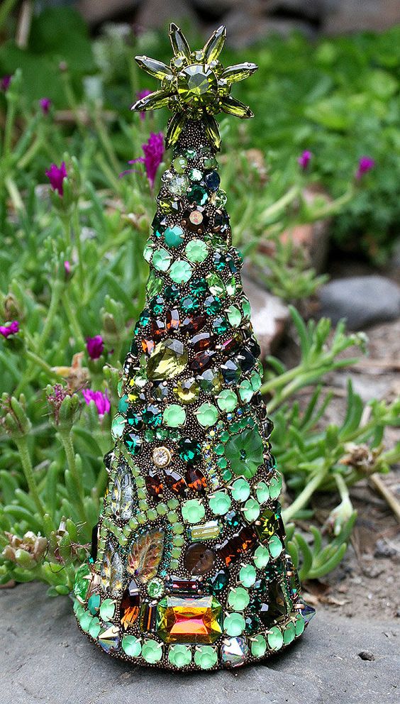 a bold jewelry Christmas cone tree in various shades of green