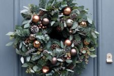 12 a lush Christmas wreath with pinecones and chocolate and copper ornaments
