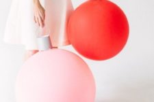 15 oversized holiday ornaments made of balloons and paper are a great idea