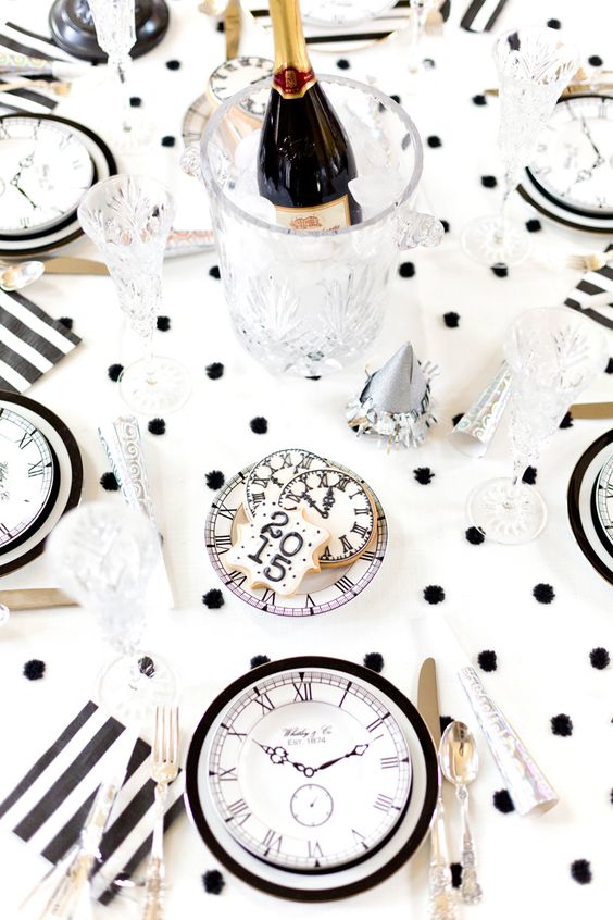a fun fur polka dot tablecloth, some silver touches and clocks for decor are all you need for New Year