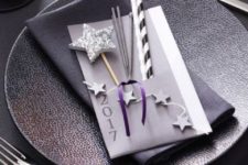 25 a textural charger, silver cutlery, litter glitter stars and ornaments in silver and purple