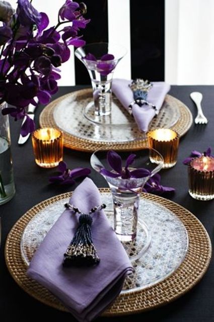 a whimsy table setting with wicker chargers, sheer plates, lilac napkins and ulta violet blooms