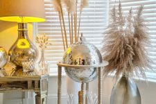 a glove disco ball bar cart is a very fun and creative decor idea for any NYE party