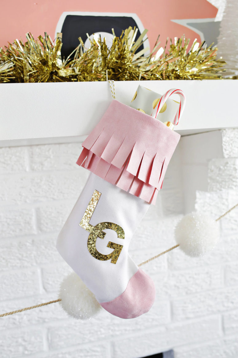 DIY faux suede Christmas stockings with glitter monograms (via abeautifulmess.com)