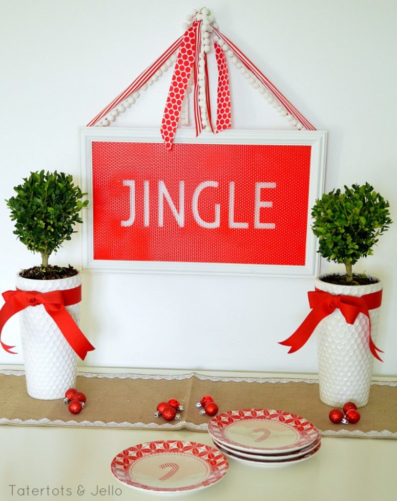 DIY faux stained holiday sign in red and white (via tatertotsandjello.com)
