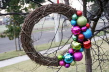 DIY grapevine wreath with colorful ornaments