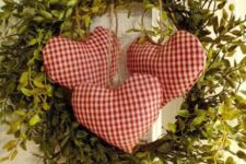 04 a cute boxwood wreath with checked hearts for a rustic or vintage space