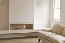 04 a neutral space with an ethanol fireplace, which looks very natural and adds wamrth to the space