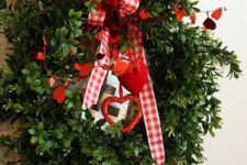 05 a faux greenery wreath with red paper hearts, checked ribbon bows and some hanging hearts