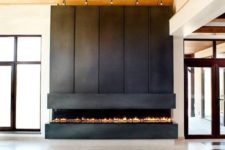05 such a fireplace clad with narrow rolled steel panels looks very modern and eye-catchy