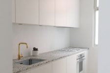 08 neutral kitchen cabinets and grey, black and white spotted terrazzo countertops
