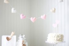 10 a cute sewn heart garland in the shades of pink for highlighting a dessert table