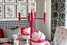 11 a modern black, white and pink tablescape with candles, heart shaped pieces and lots of patterns