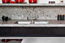 11 grey terrazzo countertops and backsplash match the dark stained cabinets