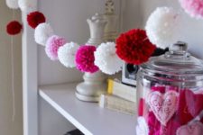 12 a cute white, pink and red pompom garland is a nice and fast to realize idea