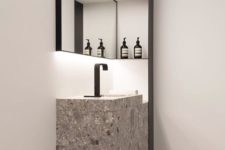 a grey and white terrazzo sink and sink stand for a minimalist bathroom
