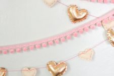 faux metallic leather and felt hearts to make garlands and pink pompom trim ones