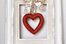 16 a vintage picture frame with a glitter hearts and a bow is easy to craft