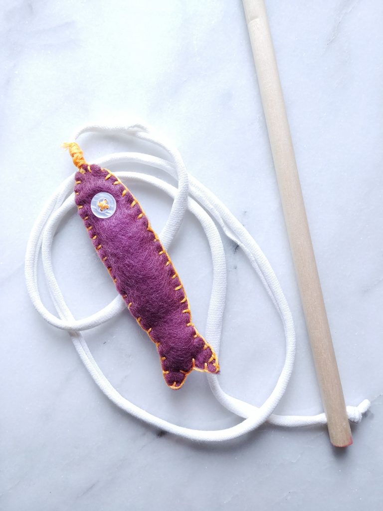 DIY fish shaped cat toy on a dowel