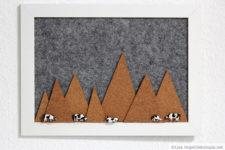DIY felt pinboard with cork mountains and cow pins