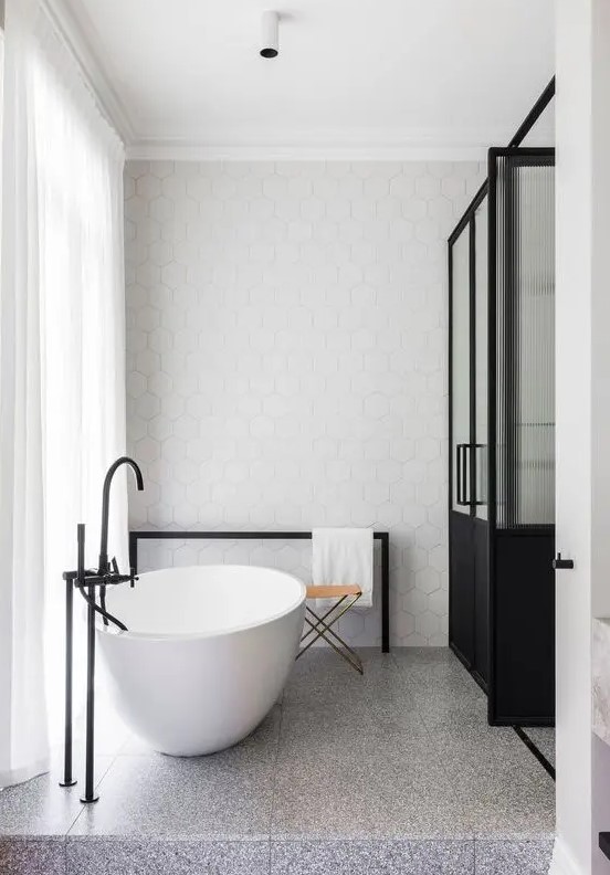 grey and white terrazzo tiles on the floor with small spots for a stylish minimalist space