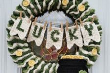 08 a fully crocheted wreath with a pot of gold, a bunting and gold coins here and there