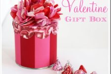 DIY striped gift box with a tissue paper flower on top