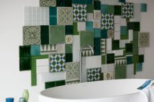 02 a colorful mosaic tile backsplash of various tiles in green shades